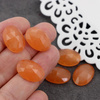 Kaboszon jadeit owal fasetowany pomarańczowy 18x13mm