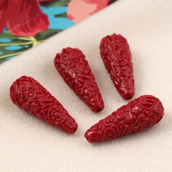 Rzeźbiona kropla czerwona 28x11mm