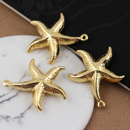 Zawieszka rozgwiazda mosiądz złocony 28mm