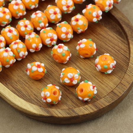 Koralik szklany w kwiatki pomarańczowy 13x12mm