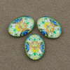Kaboszon szklany z grafiką owal 18x13mm