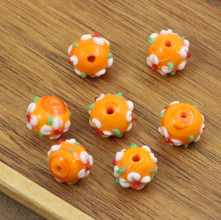 Koralik szklany w kwiatki pomarańczowy 13x12mm