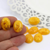 Kaboszon z żywicy owal żółty 18x13mm