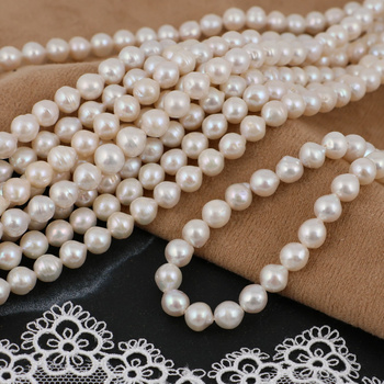 Perła słodkowodna biała kula 6mm [sznur 37cm]