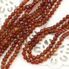 Granat (hessonit) kula fasetowana 4mm [sznur 38cm]