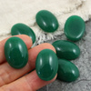 Kaboszon szklany Milky Green owal 25x18mm
