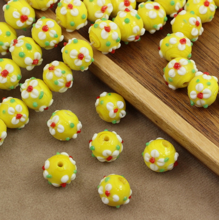 Koralik szklany w kwiatki żółty 13x12mm