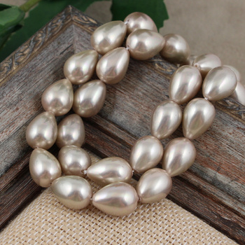 Perła seashell kropla złoto-beżowa 14x10mm