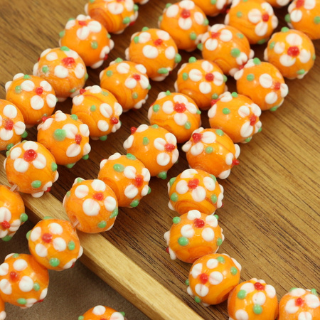 Koralik szklany w kwiatki pomarańczowy 13x12mm