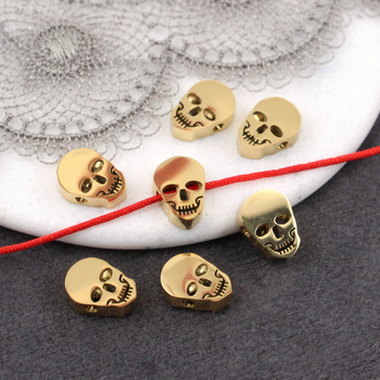 Przekładka czaszka stal szlachetna pozłacana 10x7mm