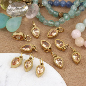 Stal szlachetna pozłacana PVD zawieszka beżowa w oprawie ZŁ 10x5mm