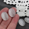 Kaboszon kocie oko owal biały 20x15mm