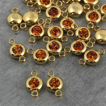 Stal szlachetna łącznik w oprawie ZŁ topaz 6mm