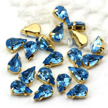 Kaboszon w oprawie łezka fasetowana błękitna 13x8mm