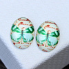 Kaboszon szklany z motylem owal zielony 25x18mm