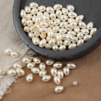 Koralik szklany perłowa kropla kremowa 9x6mm