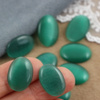 Kaboszon kocie oko owal szmaragdowy 18x13mm