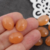 Kaboszon jadeit owal fasetowany pomarańczowy 16x12mm