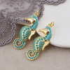Zawieszka konik morski mosiądz złocony emaliowana turkusowa 30x11mm