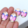 Kaboszon szklany z motylem owal różowy 25x18mm