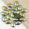 Kaboszon hematyt owal złoto-zielony 14x10mm