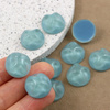 Kaboszon akrylowy moneta z falą turkusowa 18mm
