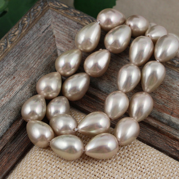 Perła seashell kropla złoto-beżowa 14x10mm