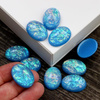 Kaboszon akrylowy owal aurora borealis blue 25x18mm