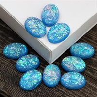 Kaboszon akrylowy owal aurora borealis blue 25x18mm