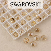 5062 Swarovski Golden Shadow Round Spike Bead 5,5mm - 1 hole [2szt]