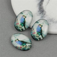 Kaboszon szklany z grafiką owal motyw ptaszka 18x13mm