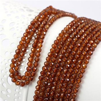 Granat (hessonit) kula fasetowana 4mm [sznur 39cm]