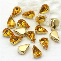 Kaboszon w oprawie łezka fasetowana żółta 13x8mm