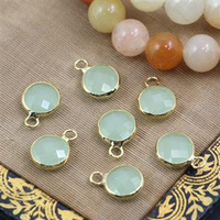 Zawieszka w złotej oprawie moneta pistacjowa 8mm