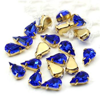 Kaboszon w oprawie łezka fasetowana szafirowa 13x8mm