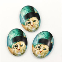 Kaboszon szklany z grafiką owal z motywem kota 25x18mm