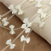 Muszla perłowa rzeźbiona kokardka 14x10mm