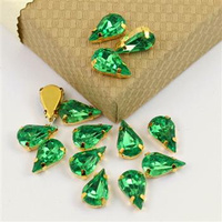 Kaboszon w oprawie łezka fasetowana zielona 13x8mm