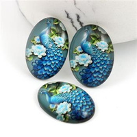 Kaboszon szklany z grafiką paw owal 25x18mm